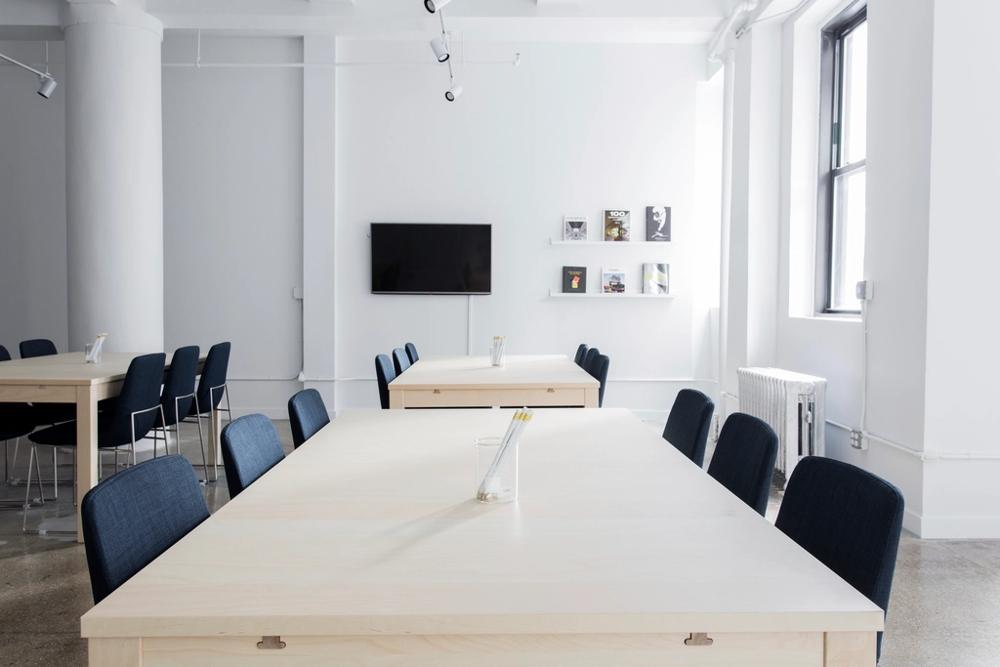 A quiet arrangement room where a funeral director meets a family — the care and premises a funeral company funds ahead of settlement.